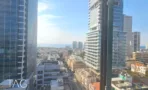 נוף מקומה גבוהה אל מגדלי העיר ואל הים, מהמשרד 300 מ