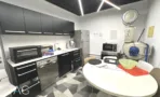 מטבח עם ארונות כהים, תנור ורצפת אריחים מעוטרת