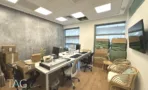 משרד להשכרה 450 מ״ר במגדל פלטינום, חדר עבודה עם עמדות מחשב וקיר בגימור בטון